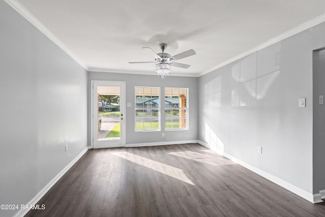 spare room featuring crown molding, dark hardwood / wood-style flooring, and ceiling fan