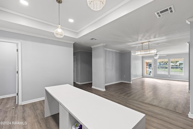 office featuring ornamental molding, ceiling fan, and dark wood-type flooring