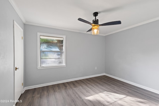 empty room featuring ceiling fan, light wood-type flooring, and crown molding