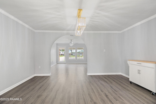 406 Orange Grove Ave, New Iberia, LA 70560 - unfurnished living room with ornamental molding, baseboards, ceiling fan, and wood finished floors