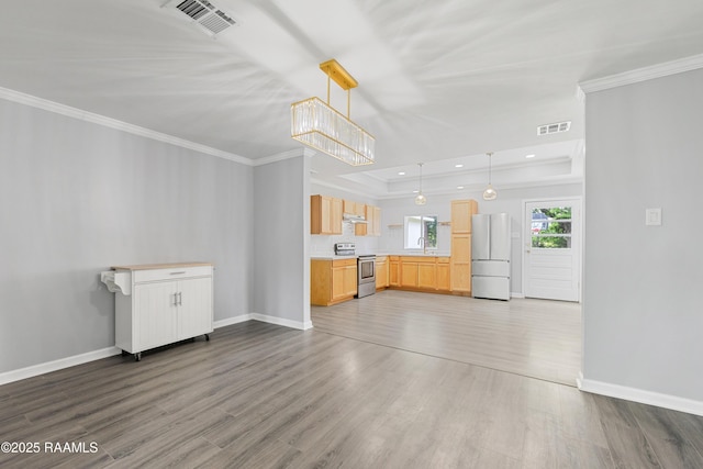 406 Orange Grove Ave, New Iberia, LA 70560 - unfurnished living room featuring ornamental molding, wood finished floors, a raised ceiling, baseboards, and recessed lighting
