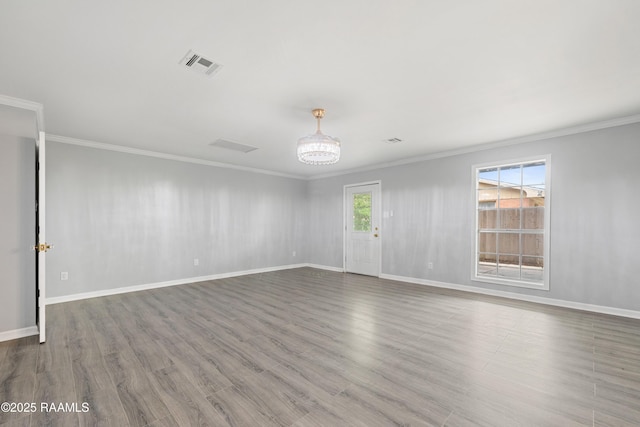 406 Orange Grove Ave, New Iberia, LA 70560 - unfurnished room featuring ornamental molding, wood finished floors, baseboards, and a chandelier