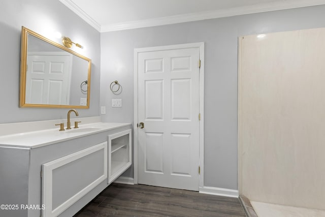 406 Orange Grove Ave, New Iberia, LA 70560 - bathroom with ornamental molding, vanity, wood finished floors, and baseboards