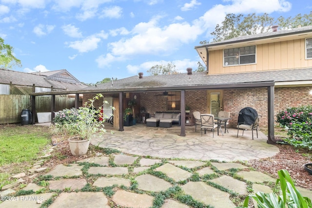 back of house featuring ceiling fan, a patio, and an outdoor hangout area