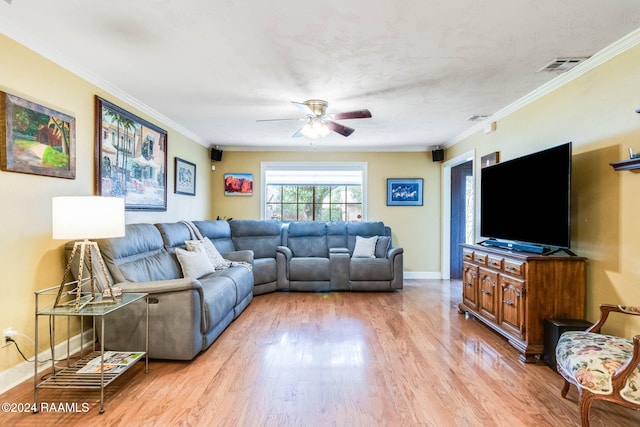 living room with light hardwood / wood-style floors, ceiling fan, and crown molding