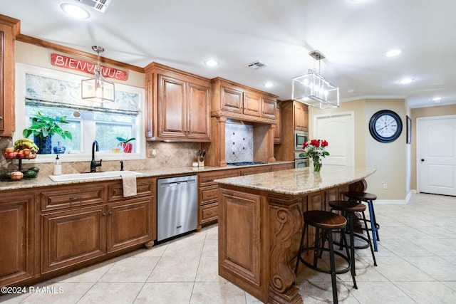 kitchen featuring stainless steel appliances, decorative light fixtures, tasteful backsplash, and a center island