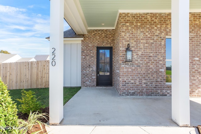 property entrance with a patio