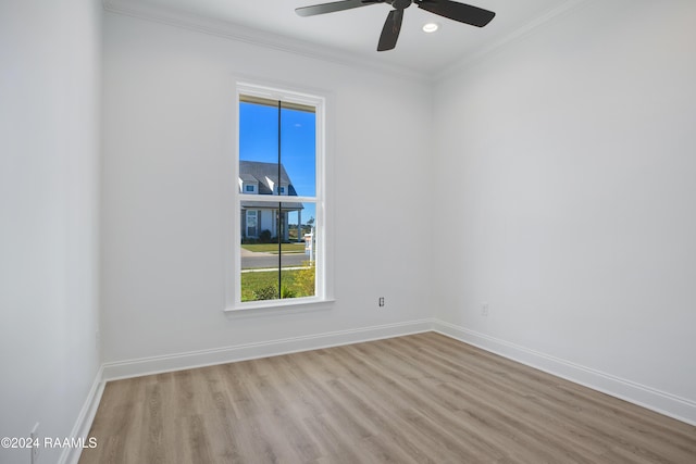 unfurnished room with ceiling fan, ornamental molding, and light wood-type flooring