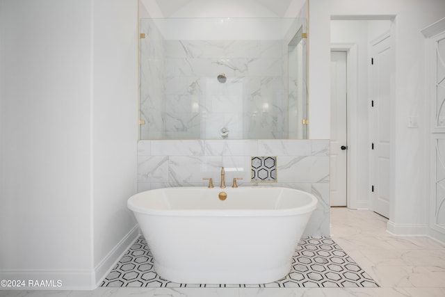 bathroom with separate shower and tub and tile walls