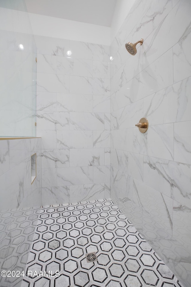 bathroom with tiled shower