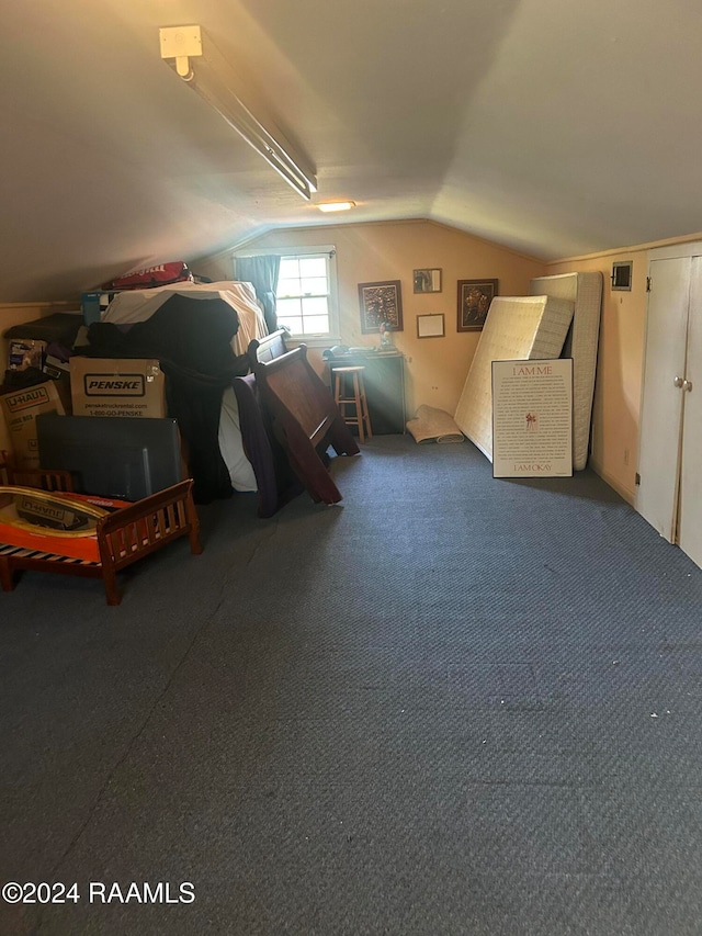 bonus room featuring lofted ceiling and carpet floors