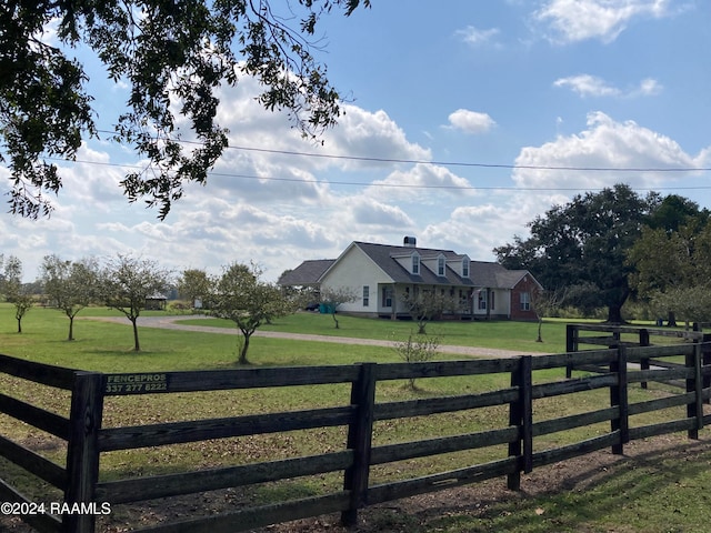 exterior space featuring a yard and a rural view