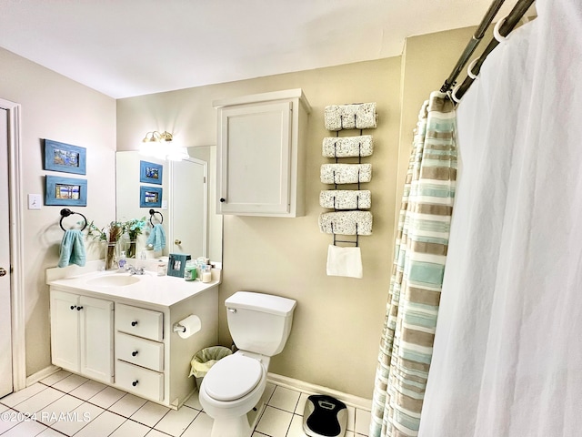 bathroom featuring walk in shower, vanity, toilet, and tile patterned flooring