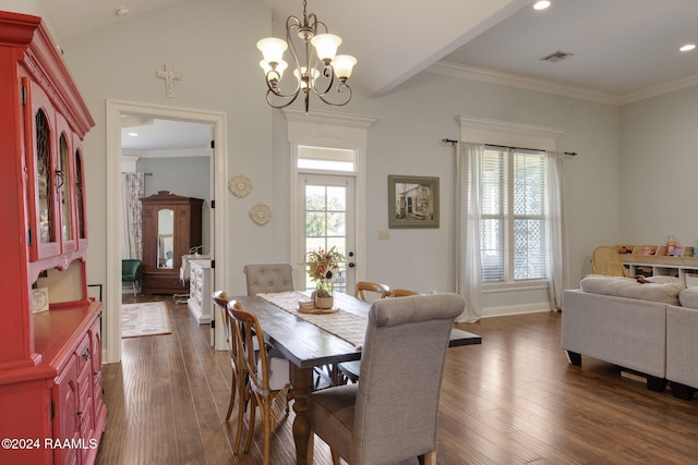 dining space with a notable chandelier, dark hardwood / wood-style flooring, lofted ceiling, and crown molding