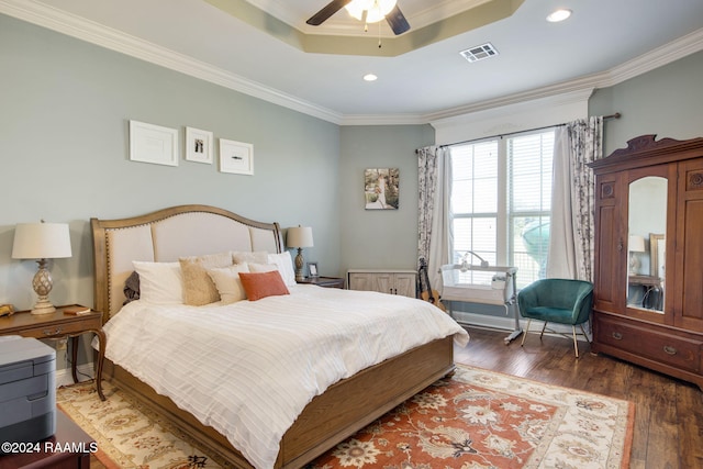 bedroom with ornamental molding, ceiling fan, and dark wood-type flooring