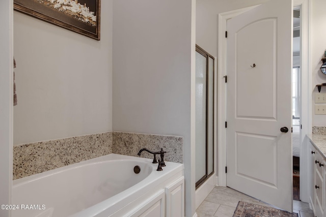 bathroom featuring shower with separate bathtub and vanity