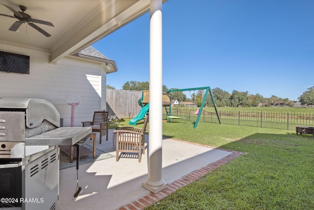 view of patio / terrace with a playground and ceiling fan