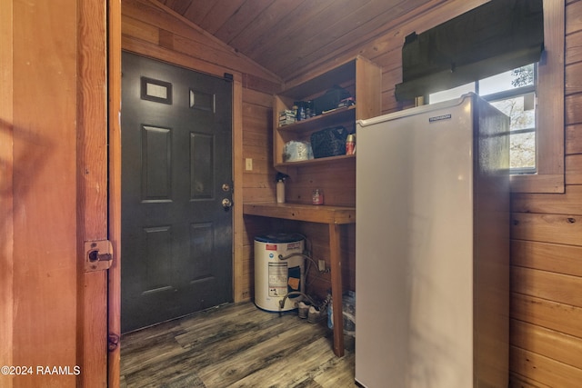 interior space with wooden walls, dark hardwood / wood-style floors, vaulted ceiling, and wooden ceiling