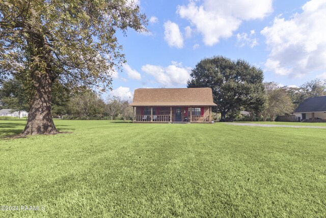 view of front of property with a front yard and a porch