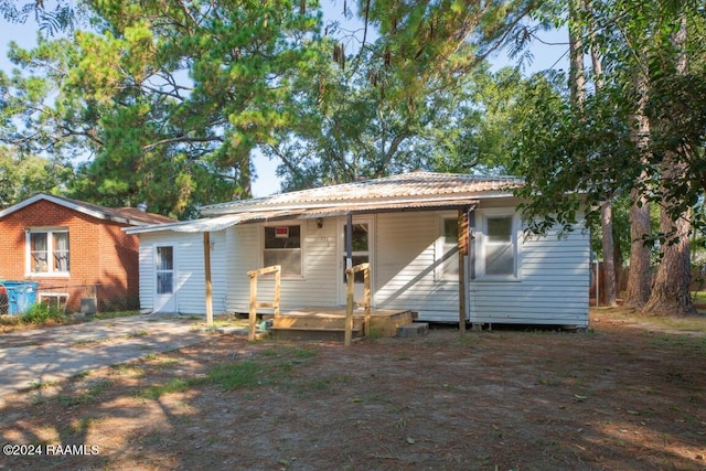 back of house with a porch