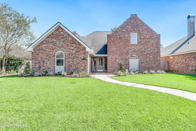 view of front of home with a front lawn