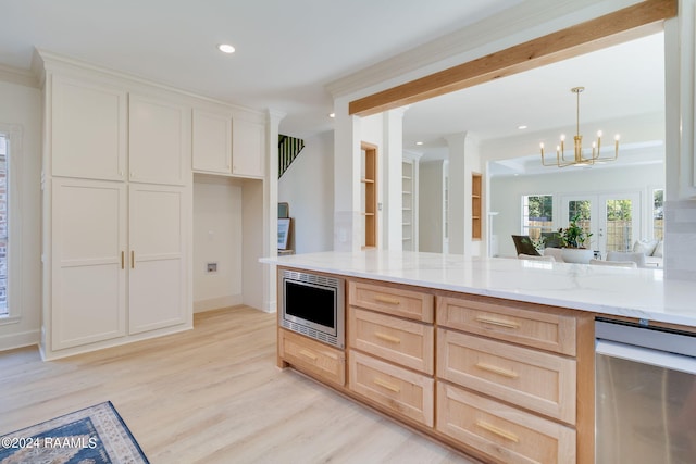 kitchen with french doors, light brown cabinets, light hardwood / wood-style flooring, hanging light fixtures, and a notable chandelier