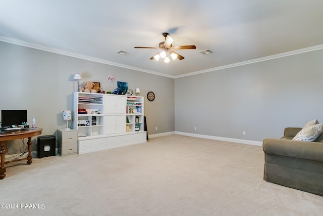 sitting room with ceiling fan, ornamental molding, and light carpet