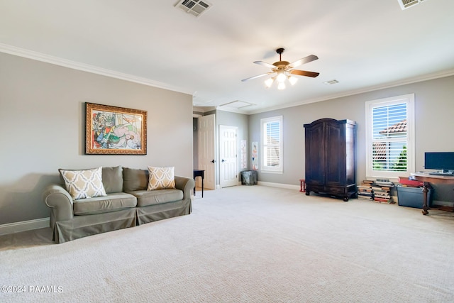 carpeted living room with crown molding and ceiling fan