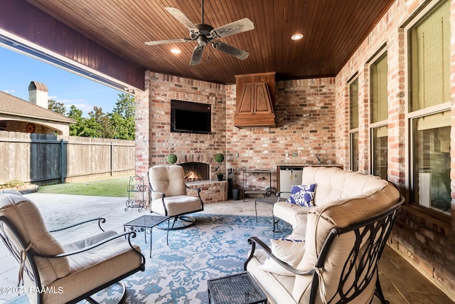 102 English Gardens Pkwy, Lafayette, LA 70503 - view of patio with fence, a ceiling fan, and an outdoor living space with a fireplace