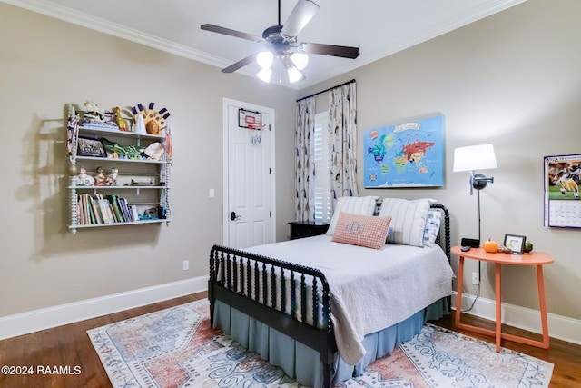 bedroom featuring crown molding, ceiling fan, and dark hardwood / wood-style floors