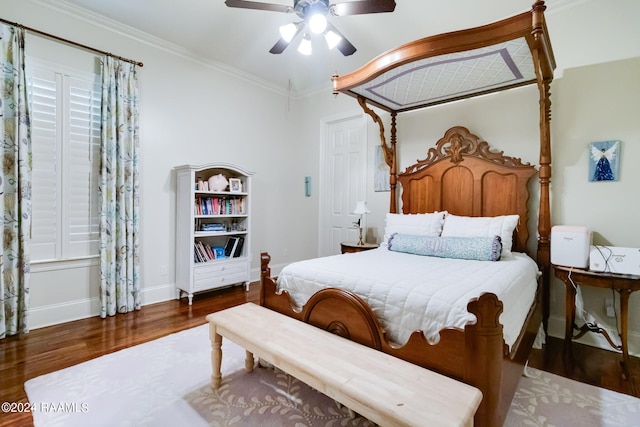 bedroom with ornamental molding, ceiling fan, and dark wood-type flooring