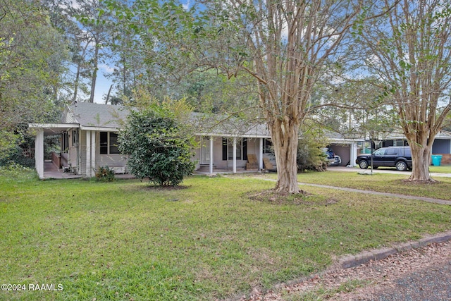 view of front facade with a front yard and a porch