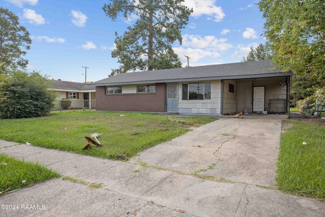 ranch-style house with a front lawn and a carport