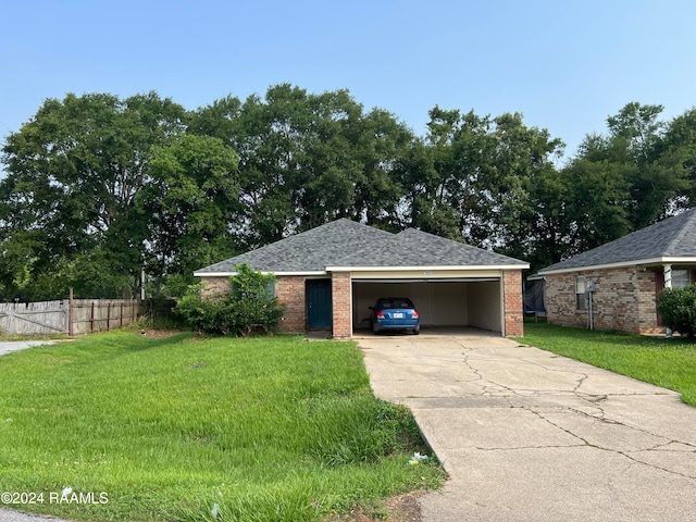 ranch-style home featuring a carport and a front lawn