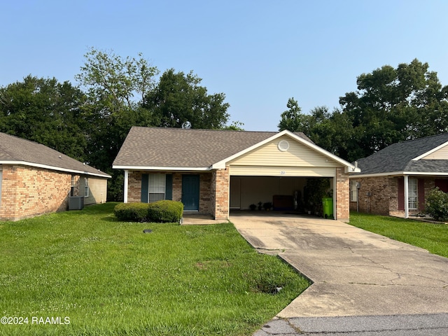 single story home with a garage, cooling unit, and a front yard