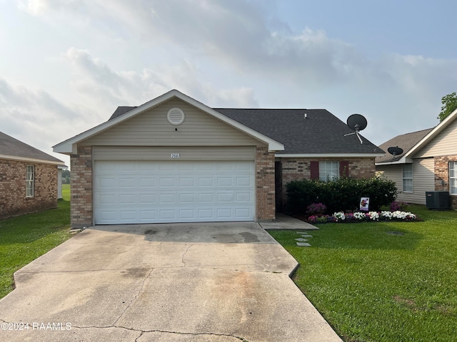 single story home with a front lawn, central AC, and a garage