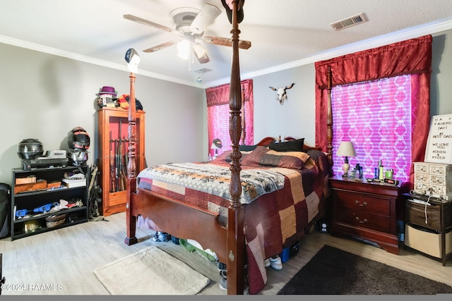 bedroom with ornamental molding, light hardwood / wood-style flooring, and ceiling fan