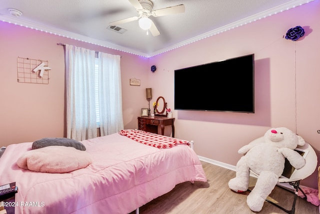 bedroom with light hardwood / wood-style flooring and ceiling fan