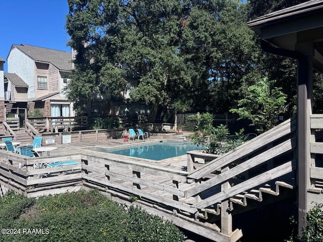 pool featuring a deck and fence