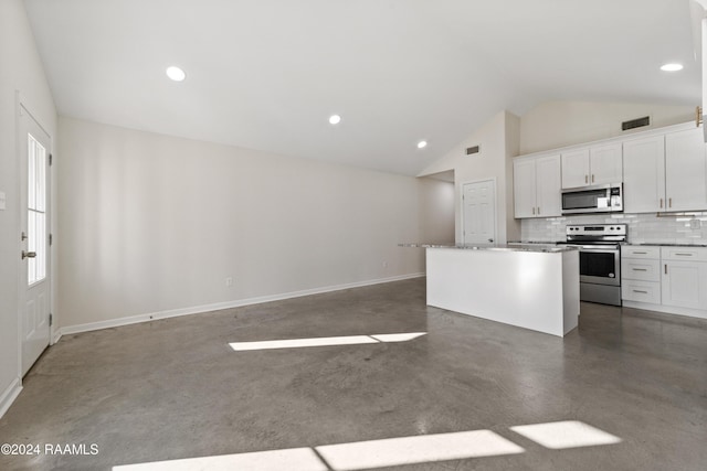 kitchen with light stone countertops, a center island, stainless steel appliances, backsplash, and white cabinets