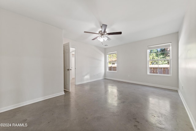 unfurnished room with ceiling fan