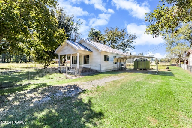 exterior space with a yard and a carport