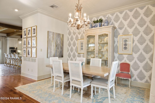 dining space with ornamental molding, beam ceiling, an inviting chandelier, and wood-type flooring