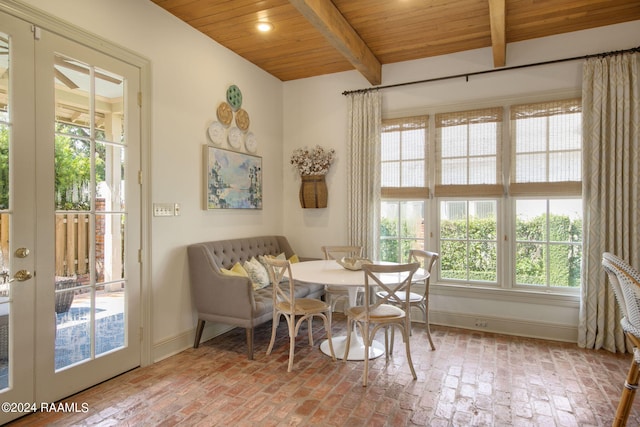 interior space featuring wooden ceiling, plenty of natural light, and beamed ceiling