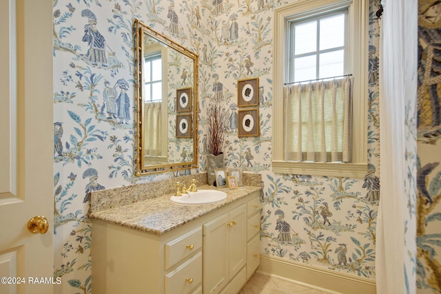 bathroom with tile patterned floors and vanity