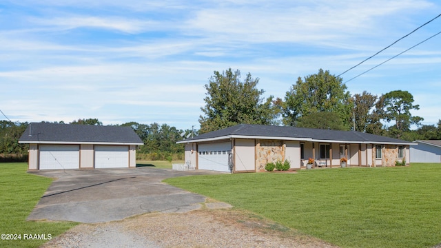 ranch-style home with covered porch, a front lawn, and a garage