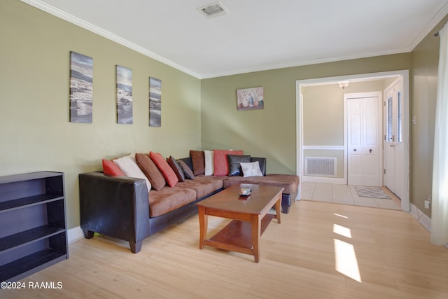 living room featuring light hardwood / wood-style flooring and crown molding