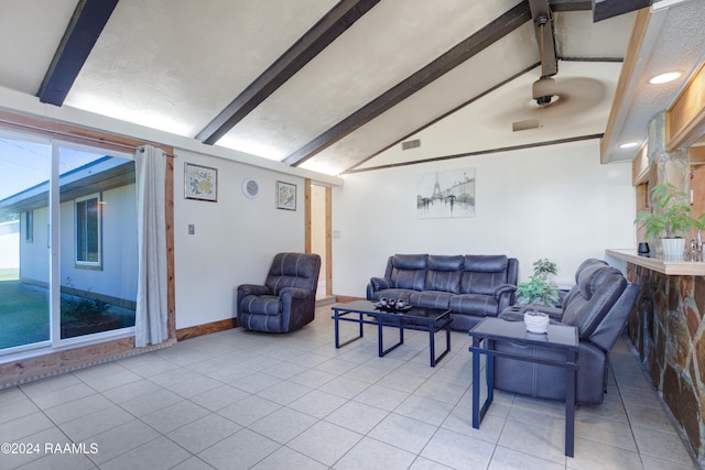 living room with vaulted ceiling with beams, light tile patterned floors, and plenty of natural light