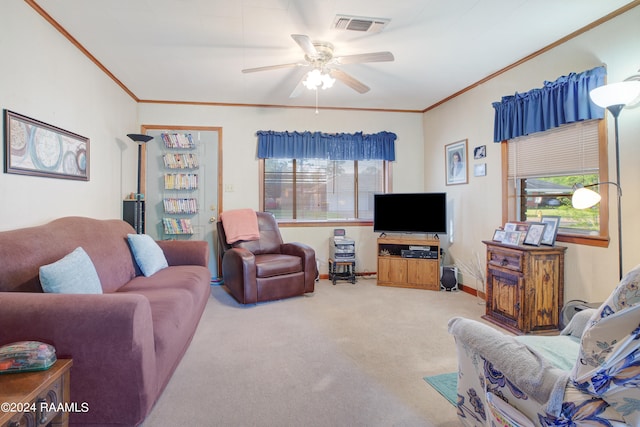 carpeted living room featuring crown molding, plenty of natural light, and ceiling fan