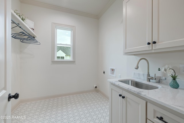 washroom with washer hookup, crown molding, cabinet space, a sink, and electric dryer hookup